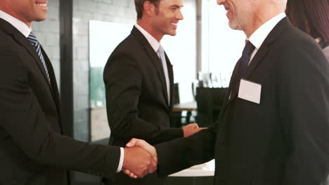 Business-people-having-a-handshake-