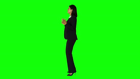 Businesswoman-speaking-with-someone-on-green-screen-