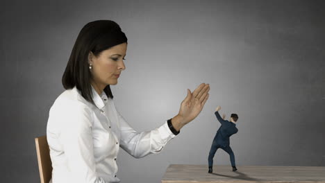 Giant-businesswoman-trying-to-shouting-scared-businessman-