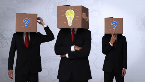 Team-of-businessman-hiding-head-with-box-