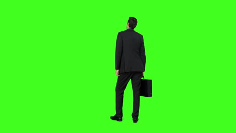 Businessman-standing-with-his-briefcase