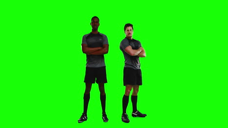 Serious-rugby-players-gesturing-in-front-of-camera