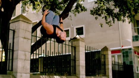 Handsome-young-man-doing-backflip-