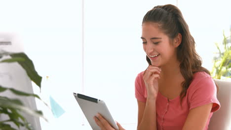 Casual-businesswoman-using-laptop-computer