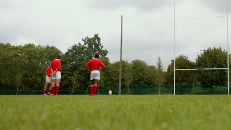 Rugby-player-taking-a-kick-and-scoring