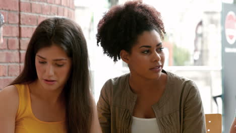 College-students-hanging-out-in-campus-cafe