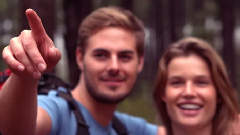 Couple-hiking-through-a-forest