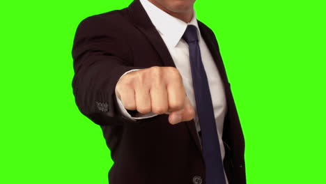 Businessman-standing-with-fist-out