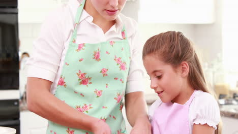 Mother-and-her-daughter-cooking-together