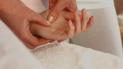 Woman-enjoying-a-hand-massage