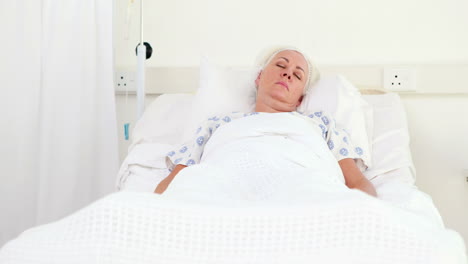 Patient-sleeping-on-medical-bed-