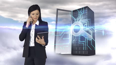 Businesswoman-having-phone-call-and-holding-tablet-computer-in-front-of-server-tower