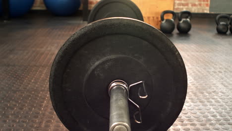 Focus-on-heavy-barbell-in-crossfit-gym