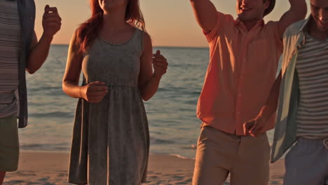 Happy-friend-dancing-at-the-beach