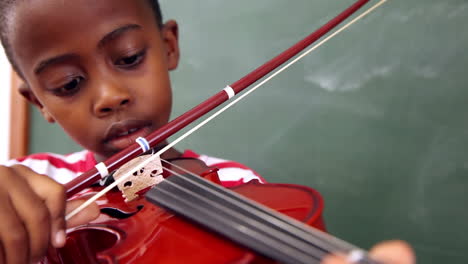 Cute-pupil-playing-violin-