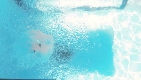 Attractive-woman-diving-in-pool