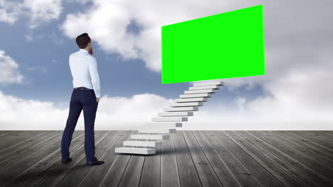 Businessman-looking-at-stair-with-green-screen-on-wood-ground-