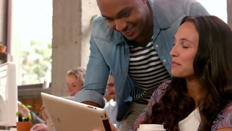 Casual-business-partners-working-together-on-a-tablet