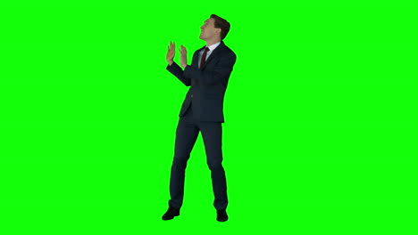 Shocking-businessman-on-green-screen-