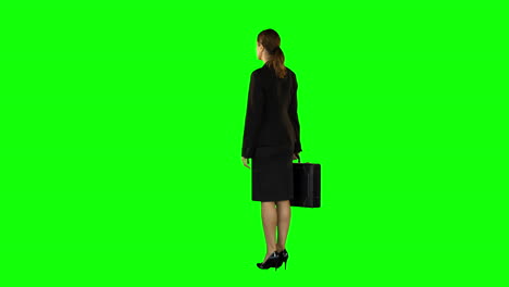 Businesswoman-standing-with-briefcase