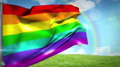 Rainbow-flag-blowing-above-field