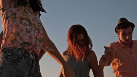 Happy-friend-dancing-at-the-beach