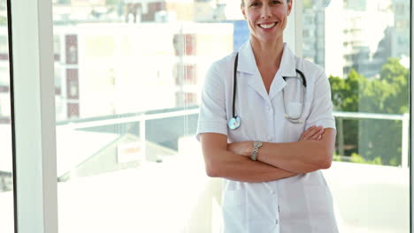 Happy-doctor-looking-at-camera-with-arms-crossed-