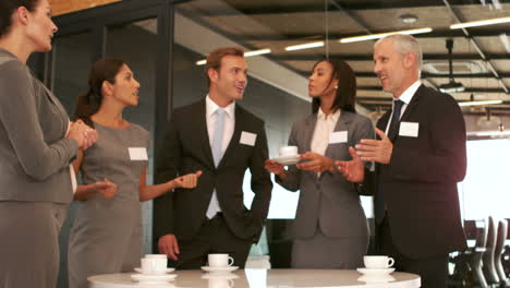 Smiling-business-people-drinking-coffee