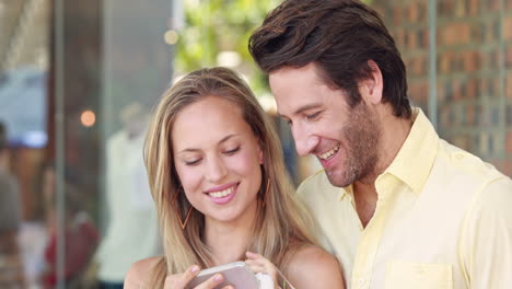 Happy-couple-taking-selfie-with-smartphone