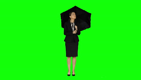 Businesswoman-wearing-umbrella-on-green-screen-
