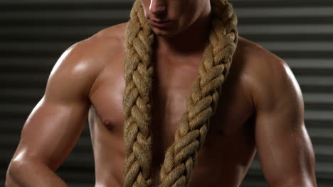 Strong-crossfitter-posing-with-rope-around-neck