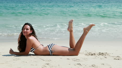 Pretty-brunette-posing-at-the-beach