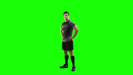 Serious-rugby-player-gesturing-in-front-of-camera-