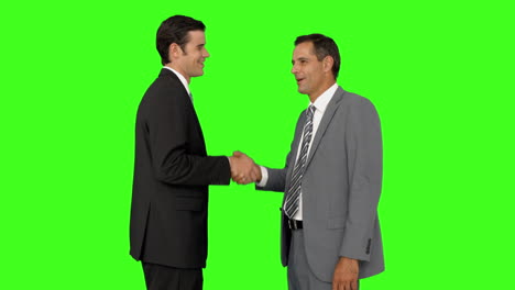 Businessmen-shaking-hands-and-smiling