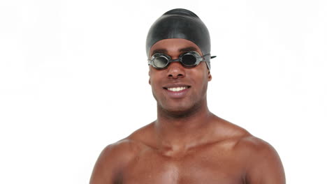 Smiling-swimmer-with-cap-and-goggles-showing-thumb-up