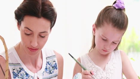 Mother-and-daughter-painting-easter-eggs-