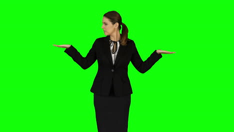 Businesswoman-wearing-something-with-her-hands-on-green-screen-