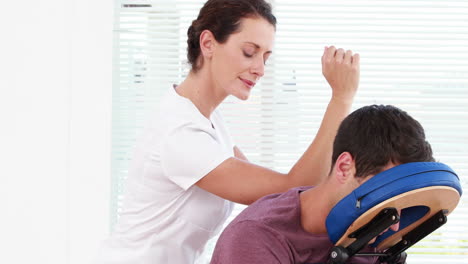 Physiotherapist-giving-shoulder-massage-to-patient