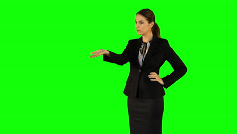 Businesswoman-wearing-something-with-her-hands-on-green-screen-