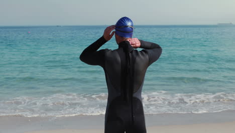 Rear-view-of-swimmer-getting-ready-at-the-beach