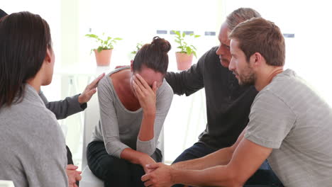 Concerned-patients-comforting-another-in-rehab-group