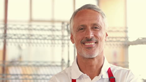 Happy-server-looking-at-camera-with-arms-crossed-