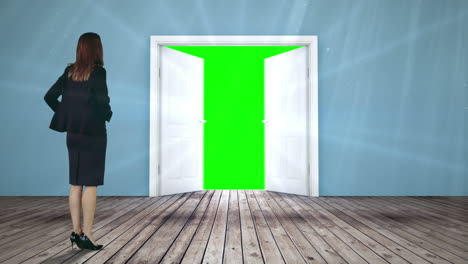 Door-opening-to-green-screen-watched-by-businesswoman