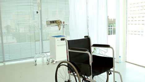 Black-wheelchair-in-medical-bedroom-