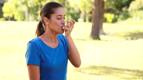 Woman-using-her-inhaler