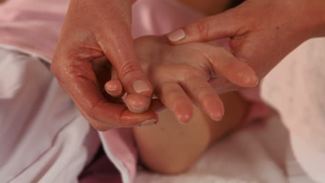 Woman-enjoying-a-hand-massage