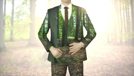 Businessman-standing-with-hands-on-hips-with-forest-overlay-