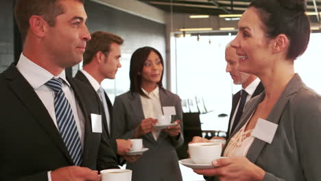 Smiling-business-people-drinking-coffee