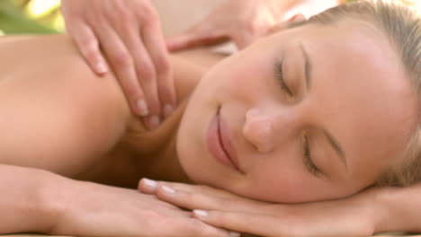 Woman-enjoying-a-shoulder-massage