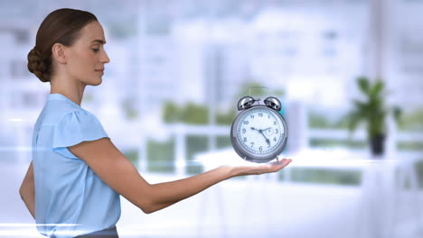 A-businesswoman-holding-alarm-clock